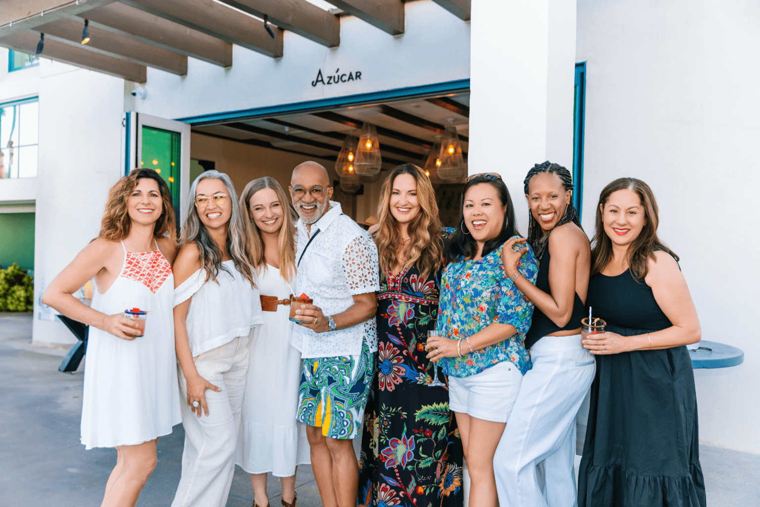Group of friends at event posing for photographer